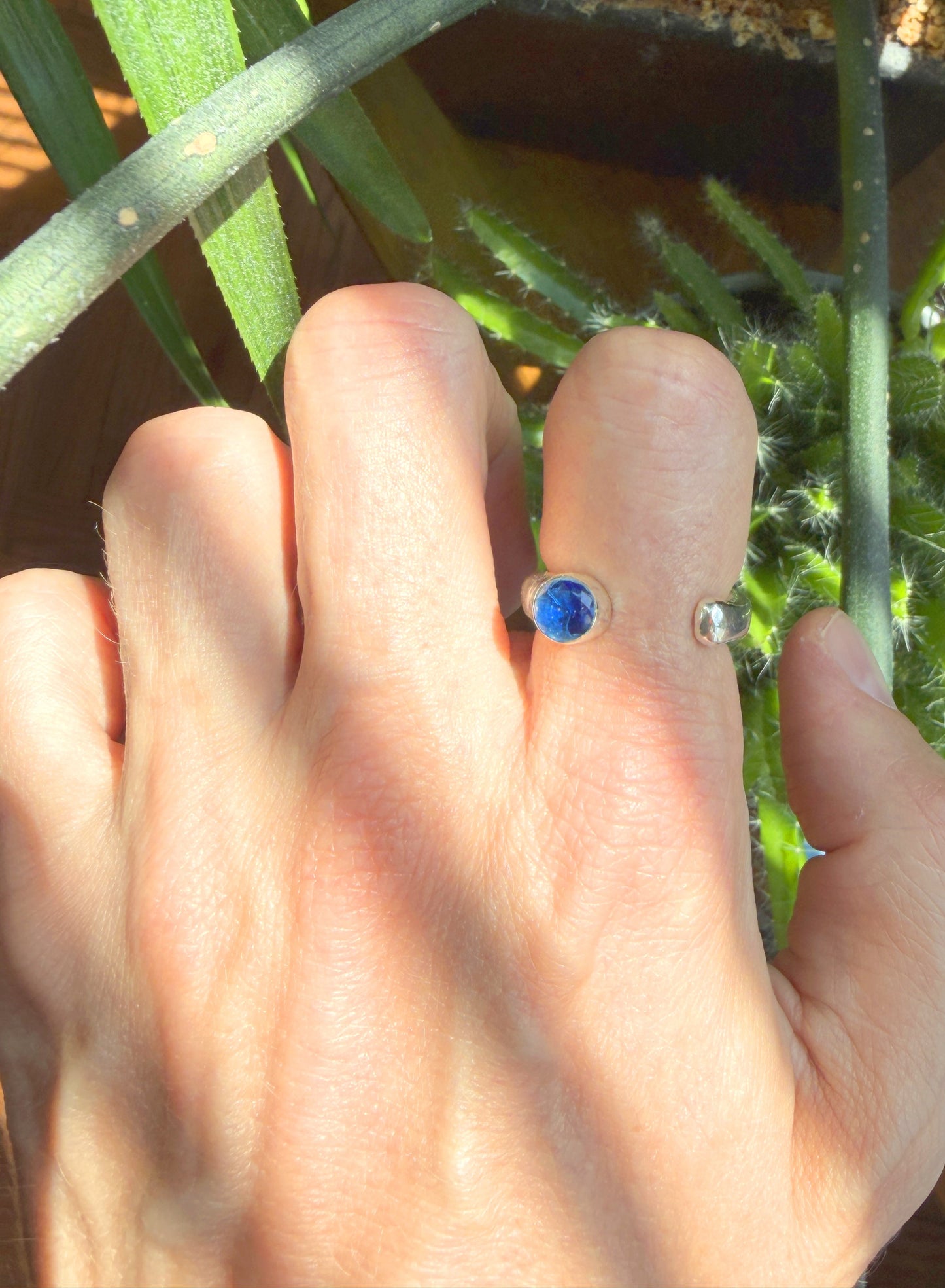 STERLING SILVER RING WITH A NATURAL BLUE TOPAZ